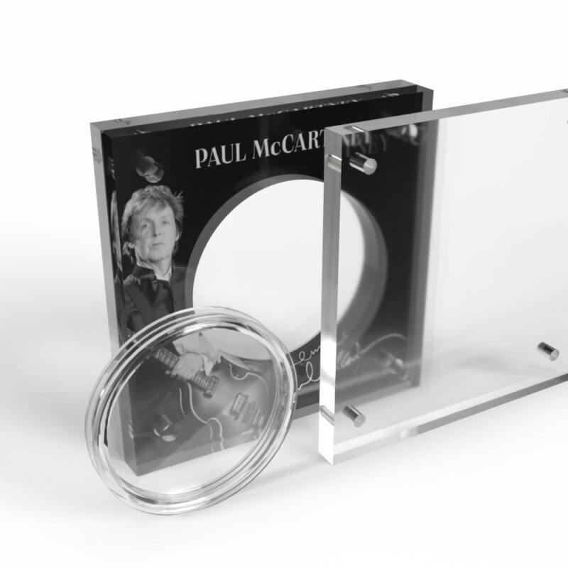 Commemorative coin display case with famous musician image.