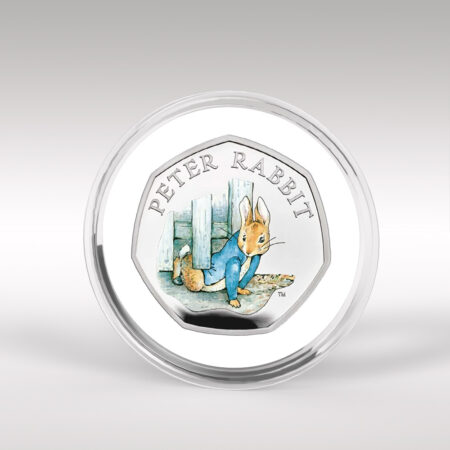 Peter Rabbit commemorative coin in protective case.