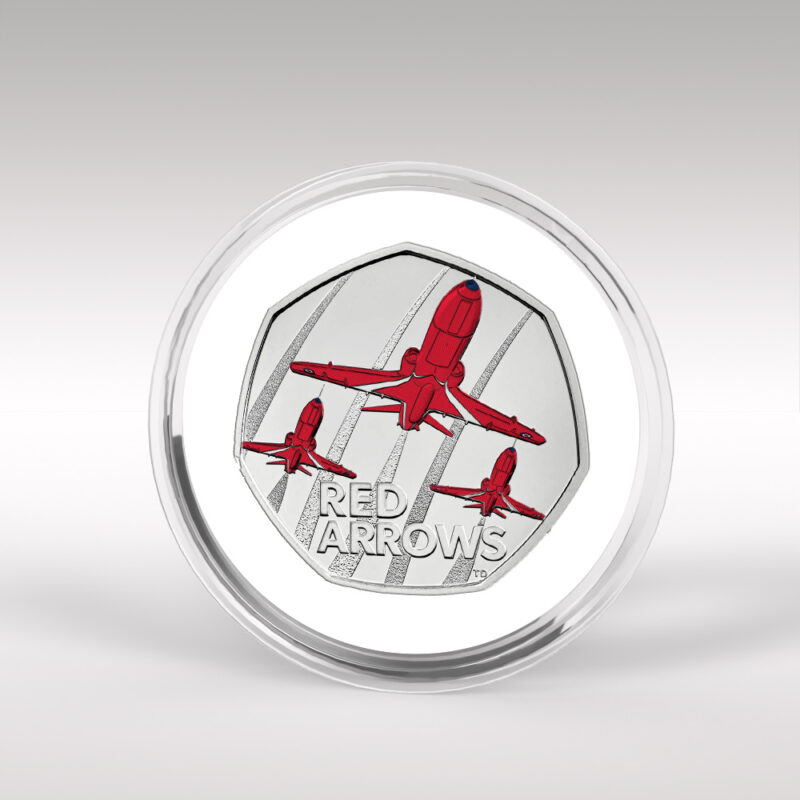 Red Arrows commemorative coin with aircraft design.