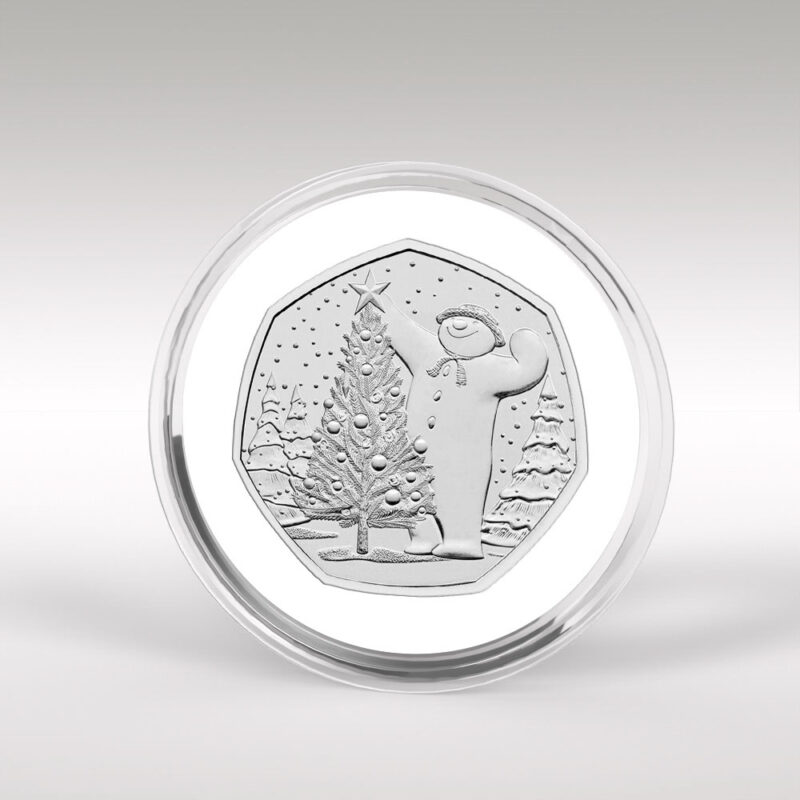 Silver coin featuring festive snowman and Christmas tree.